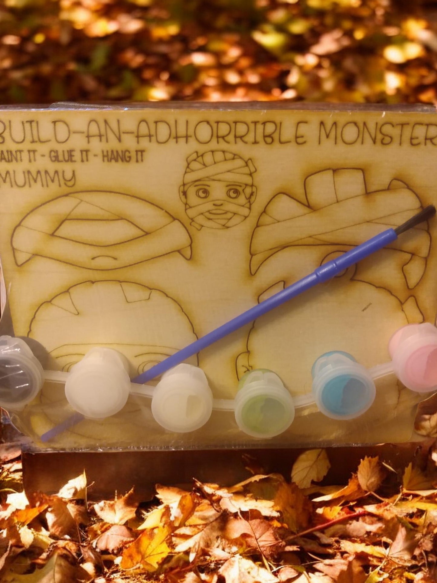 Paint kit, ornament, twine/magnet, paint and paint brush