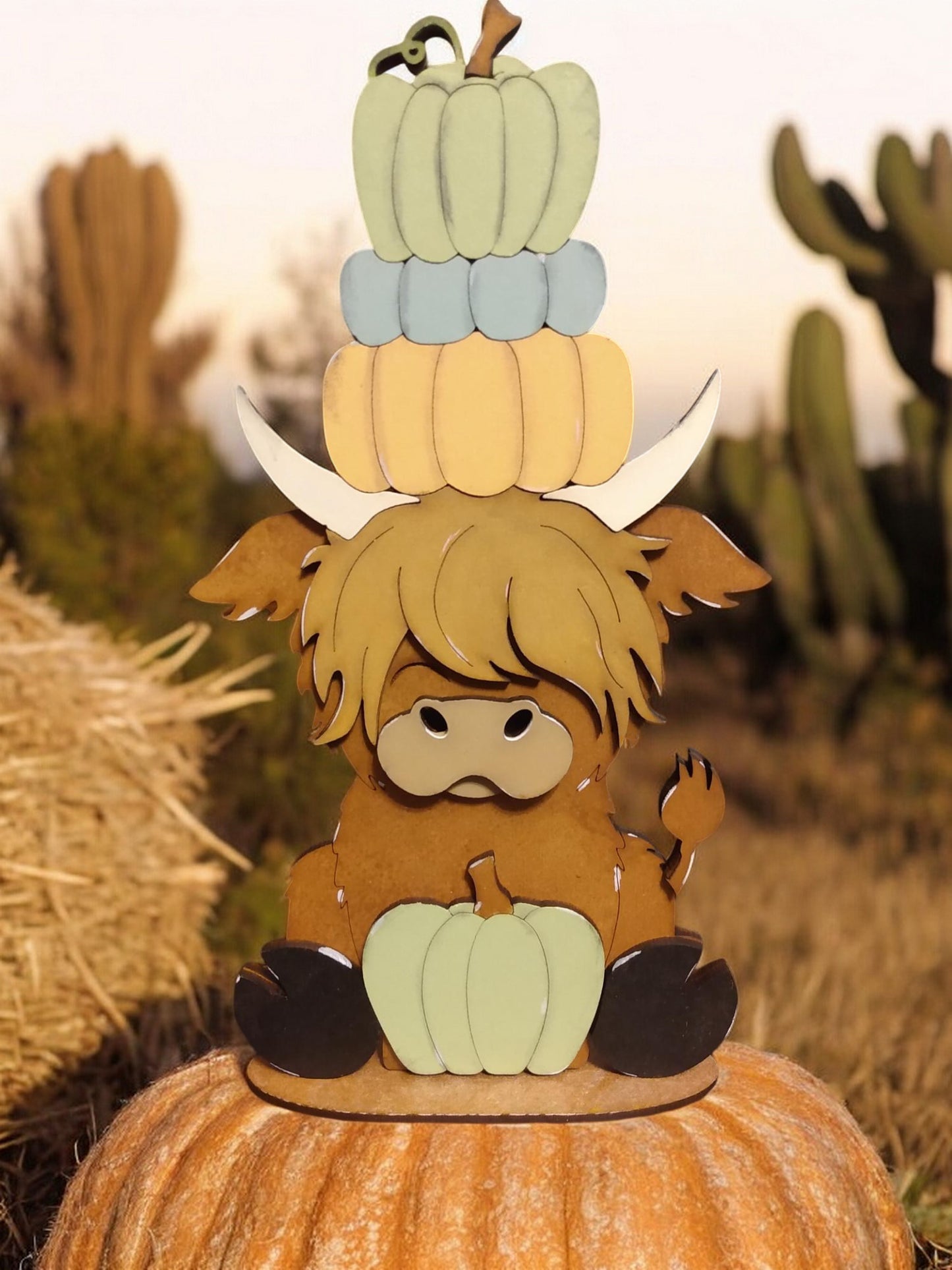 Highland cow shelf sitter with pumpkins