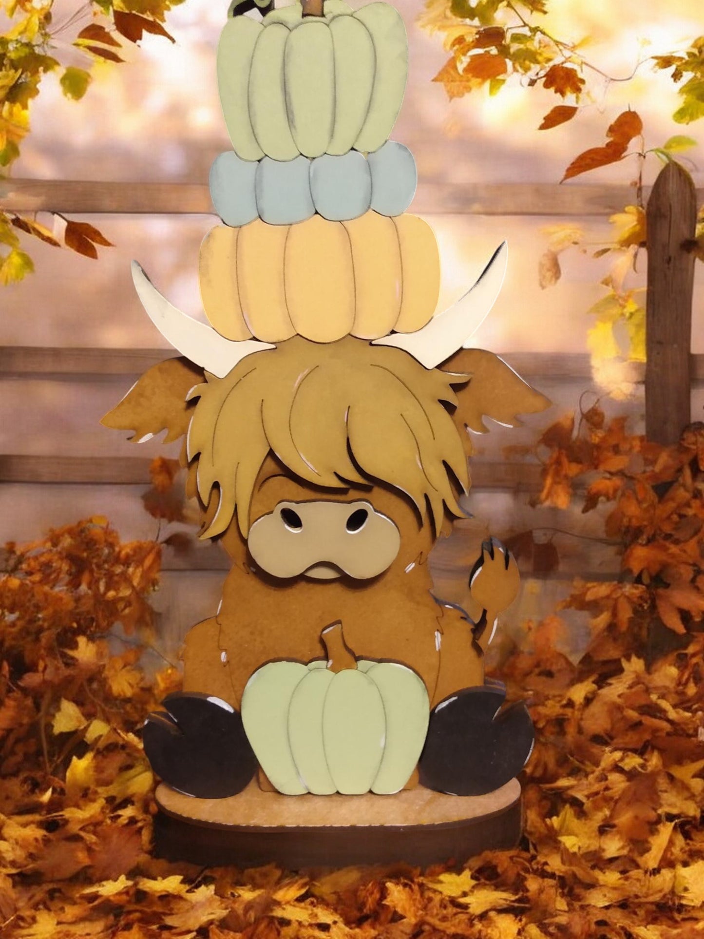 Highland cow shelf sitter with pumpkins