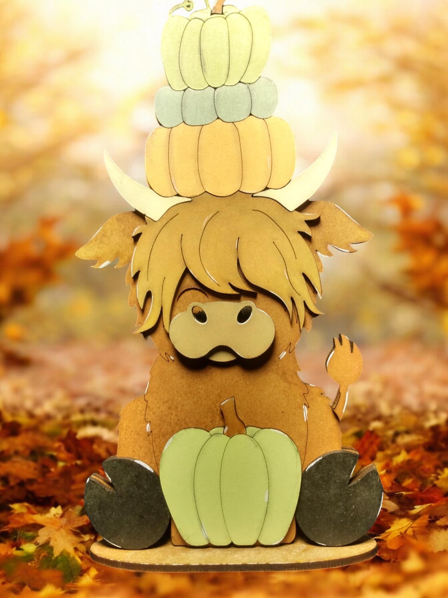 Highland cow shelf sitter with pumpkins