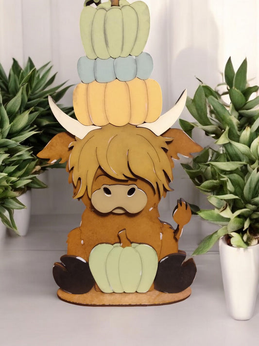 Highland cow shelf sitter with pumpkins